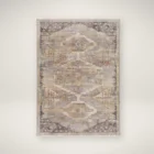 Traditional-inspired rug in muted shades of taupe, grey, and gold with a distressed medallion pattern.