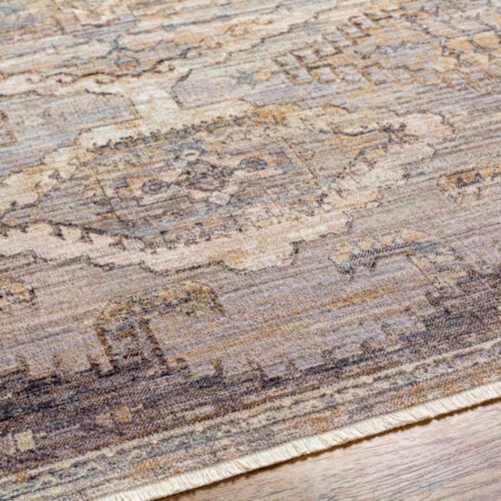 Traditional-inspired rug in muted shades of taupe, grey, and gold with a distressed medallion pattern.