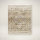 Neutral machine-woven rug in warm beige and taupe tones with a softly distressed, layered pattern.