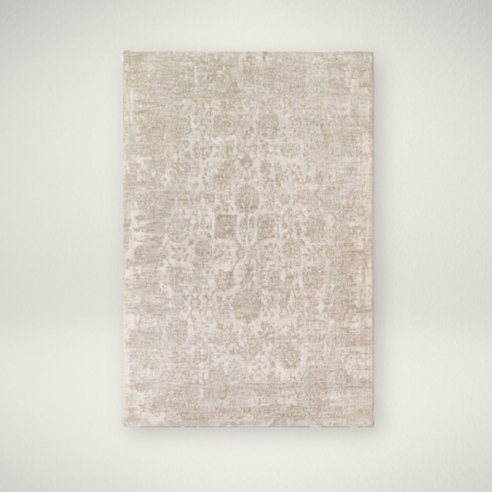 SU Masterpiece Machine Woven Rug Neutral woven rug with a subtle distressed floral medallion pattern in beige and ivory tones.