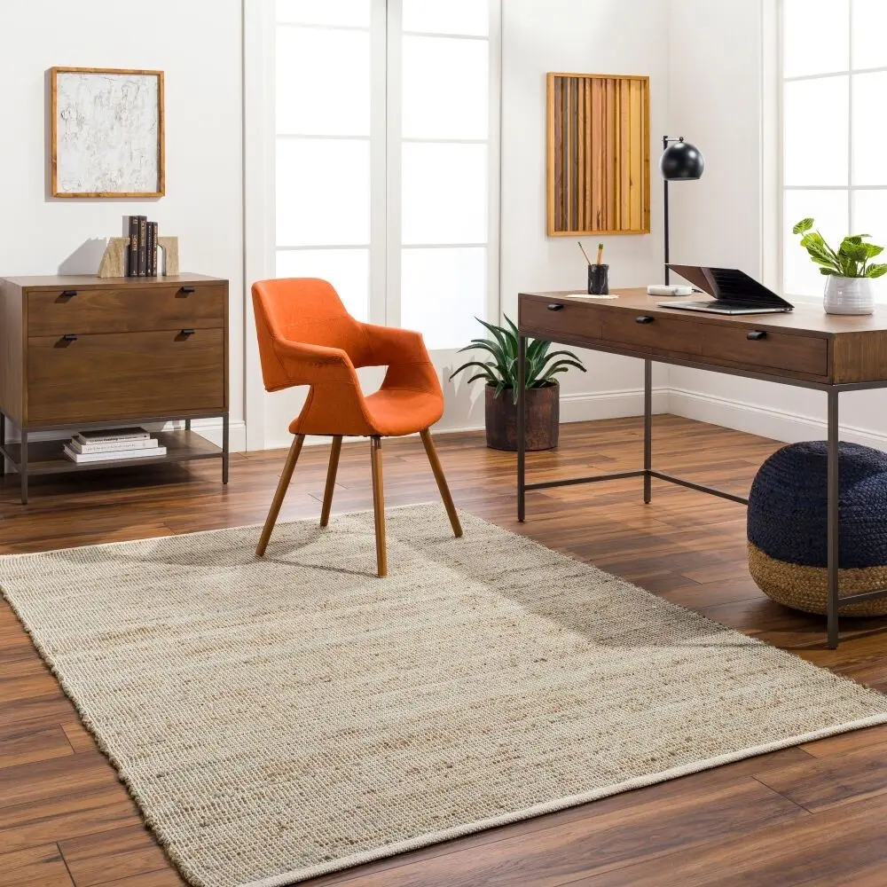 Neutral woven area rug in warm beige and ivory tones with subtle texture.
