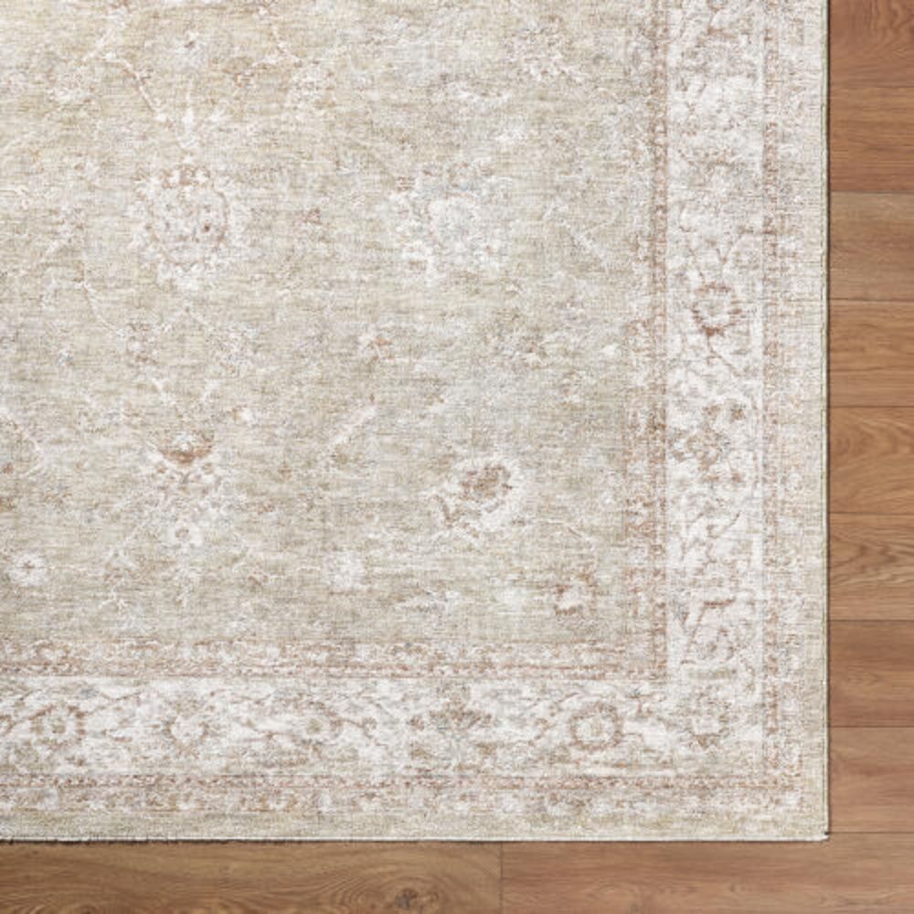 Beige and ivory rug with subtle floral motifs and a delicate bordered pattern.