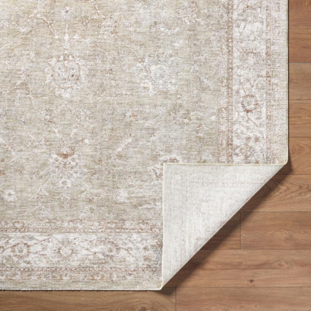 Beige and ivory rug with subtle floral motifs and a delicate bordered pattern.
