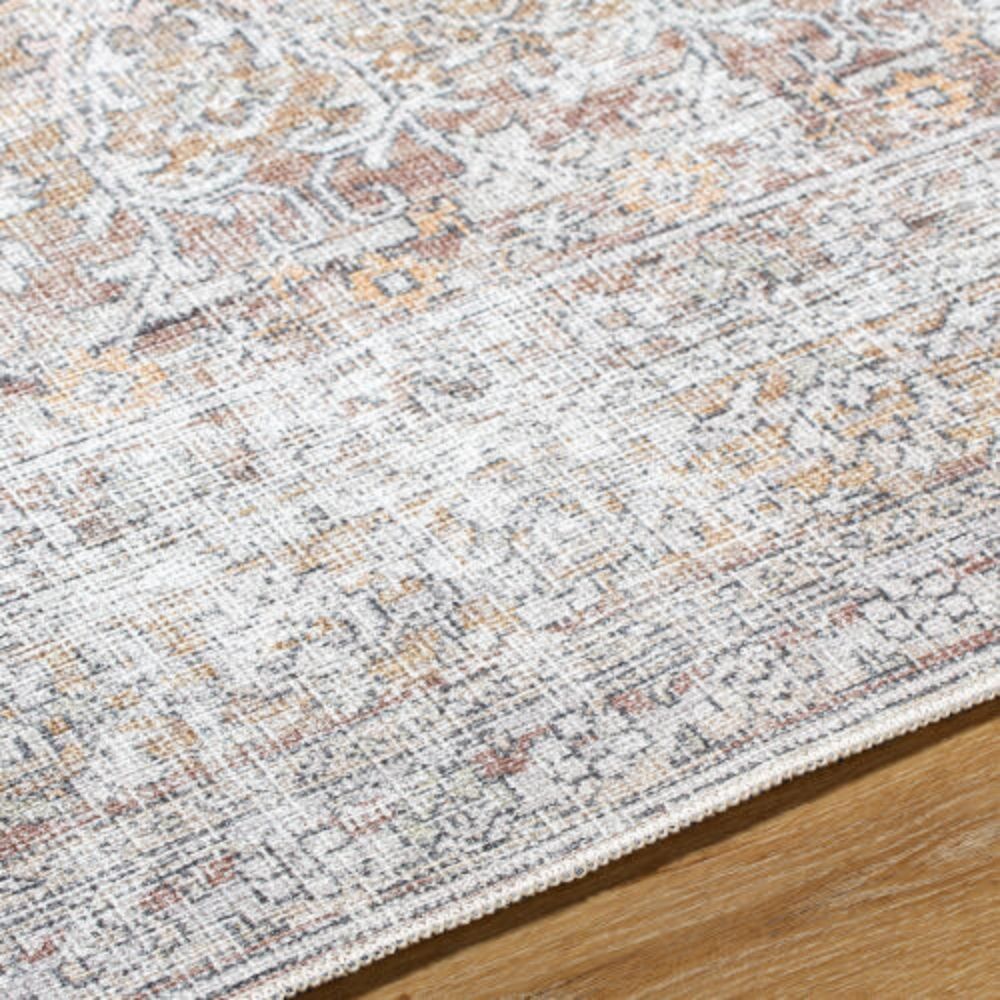 Neutral traditional area rug with soft distressed patterns in beige, ivory, and grey tones.