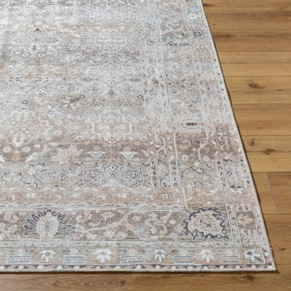 Traditional patterned area rug in soft neutral tones of beige, ivory, and grey.