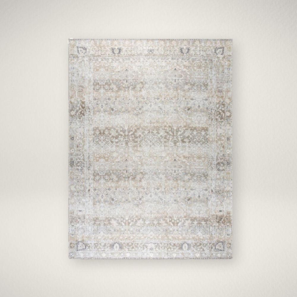 Surya Rainier Machine Woven Rug Traditional patterned area rug in soft neutral tones of beige, ivory, and grey.