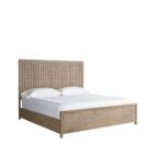 A rustic modern panel bed with a woven wood lattice headboard and a solid wood footboard in a natural weathered finish.