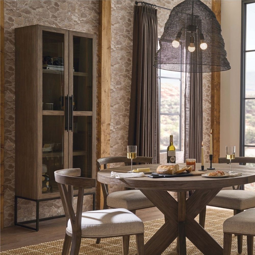 Tall wood and glass cabinet with black metal base and long vertical handles.