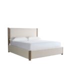 A contemporary upholstered bed in soft beige fabric with a tall padded headboard and natural wood trim accents on the corners and legs.