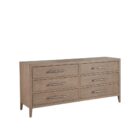 A six-drawer dresser in a light natural wood finish with long horizontal metal handles and tapered legs.