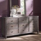 A nine-drawer dresser in a rich cocoa brown wood finish with textured grain, slim brass hardware, and tapered legs.