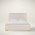 A contemporary upholstered bed with soft cream fabric panels framed by light natural wood, featuring rounded corners and a modern profile.