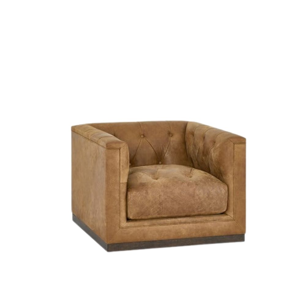 Square tufted leather swivel chair with deep seat and modern silhouette.