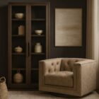 Dark wood storage cabinet with glass-front double doors and interior shelving.