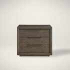 A dark wood nightstand with three drawers, slim black metal handles, and a bold plinth base for a modern grounded look.