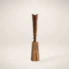 Tall handcrafted wooden sculpture with natural grain and geometric carved detailing.