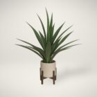 Artificial agave tree in a modern beige pot with wooden stand.