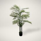 Artificial palm plant with tall green fronds in a black pot.