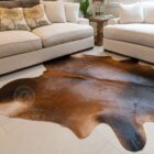 Natural mahogany brown cowhide rug featuring rich tones and a soft, organic silhouette.