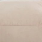 Square pouf in soft beige fabric with a casual, structured design.