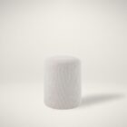 Round ivory pouf with soft textured upholstery.