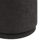 Round black pouf with sleek fabric upholstery.