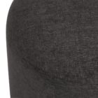 Round black pouf with sleek fabric upholstery.