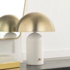 Renwil Solero table lamp with a white cylindrical base and a dome-shaped brushed brass shade.
