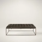 Universal Travers bench with tufted leather seat and open metal base
