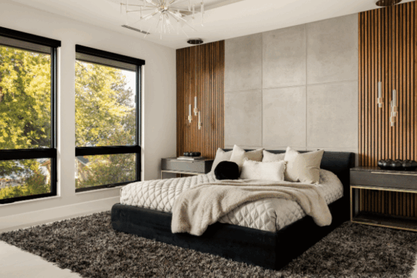 Contemporary primary bedroom with wood slat feature wall and neutral bedding designed by Urbanhome Interior Design