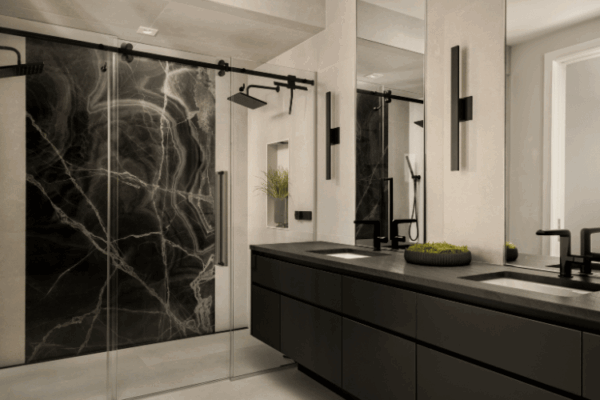 Modern luxury ensuite bathroom with double vanity and marble shower wall designed by Urbanhome Interior Design