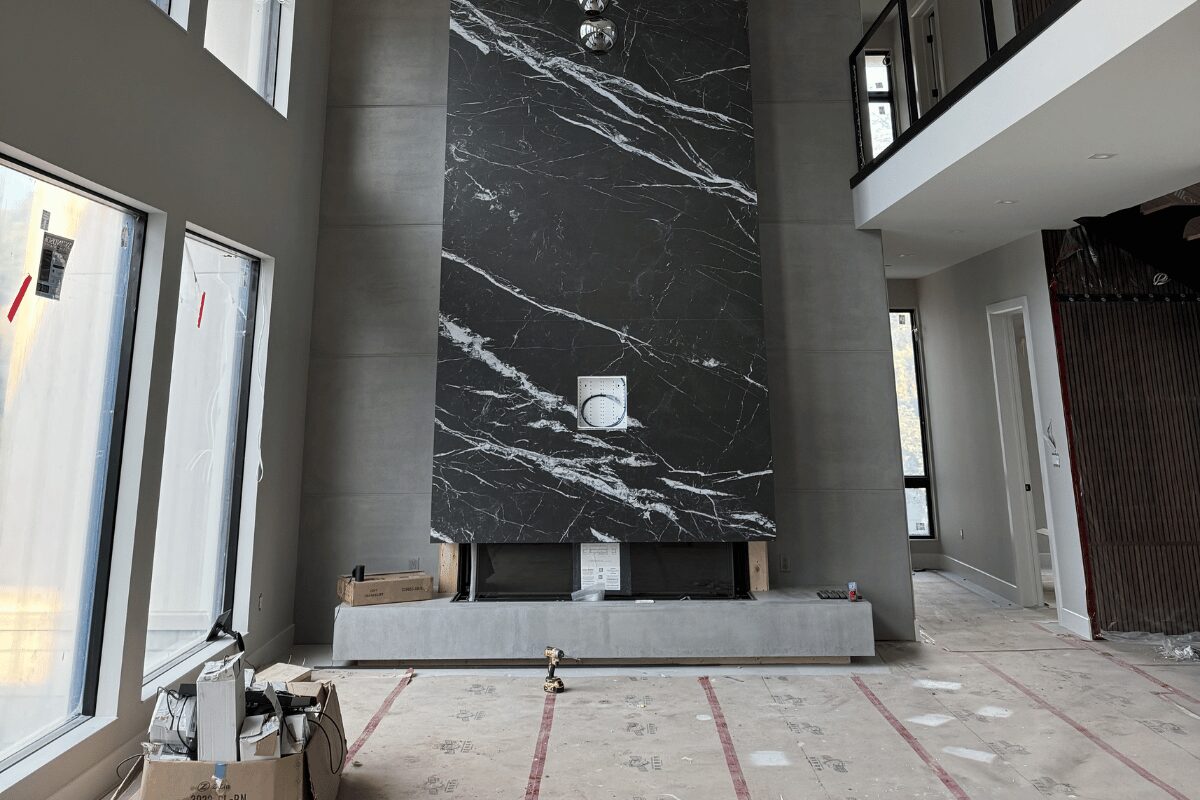 Luxury living room with dramatic marble fireplace feature wall designed by Urbanhome Interior Design in the Modern Manor on Lake St Clair