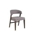 Upholstered dining chair with a curved wraparound back, light neutral fabric, and solid wood legs in a warm brown finish.