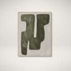 Abstract wall art featuring bold organic shapes in deep green tones on a soft neutral background, framed in a light wood frame.