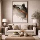 Abstract artwork with fluid black, taupe, and warm amber tones resembling flowing ink or water movement on a soft neutral background.