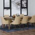 Modern dining chair with beige upholstered seat and back, and tapered wood legs in a warm finish.