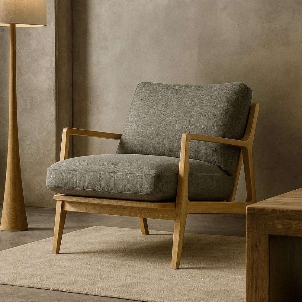 Upholstered armchair with a soft green textured fabric seat and back, paired with a light wood frame and clean, modern lines.