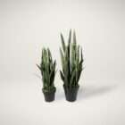 Artificial snake plant in a black pot featuring tall, upright green leaves with variegated striping.