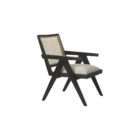 Modern black wood accent chair with woven cane back and neutral upholstered seat.