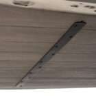 Rectangular wood dining table with a natural live-edge inspired top and solid panel base legs in a warm medium wood finish.