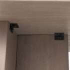 Rectangular wood dining table with a natural live-edge inspired top and solid panel base legs in a warm medium wood finish.