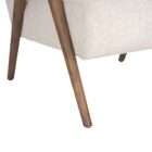 Upholstered accent chair in a soft neutral fabric with a solid wood frame and exposed arms in a warm medium wood tone.