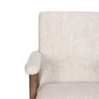Upholstered accent chair in a soft neutral fabric with a solid wood frame and exposed arms in a warm medium wood tone.