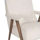 Upholstered accent chair in a soft neutral fabric with a solid wood frame and exposed arms in a warm medium wood tone.