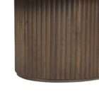 Round wood coffee table with a smooth top and a fluted cylindrical base in a warm medium wood finish.