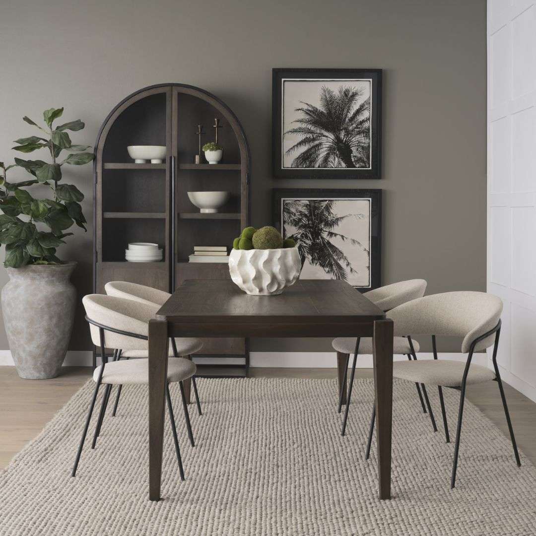 Rectangular wood dining table with a clean top and tapered legs in a warm medium-dark finish.