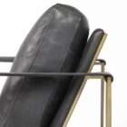 Modern black leather accent chair with sleek brass metal frame and minimalist silhouette.