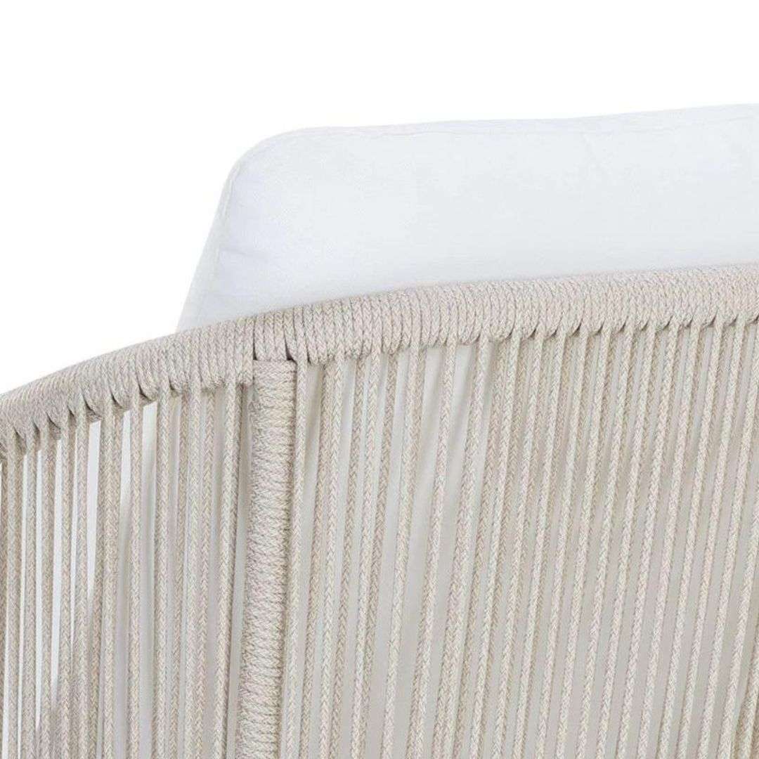 Outdoor lounge chair with woven rope sides in a soft neutral tone, featuring a light frame and plush white seat and back cushions.