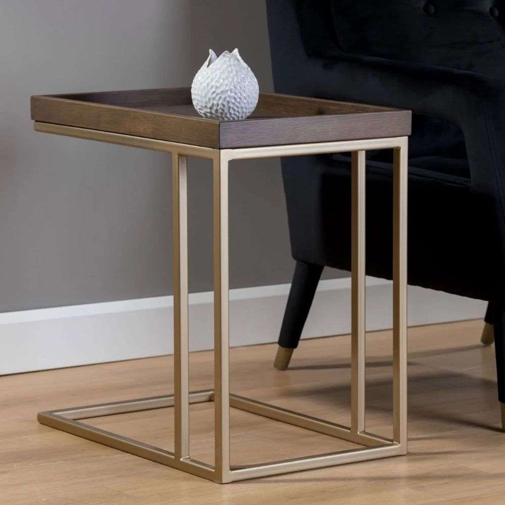 Rectangular tray-top side table with a dark wood surface and slim gold metal frame.