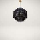 Black tiered chandelier with layered jute shades and a brass suspension rod creating a textured, modern lighting fixture.